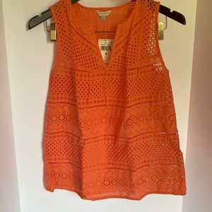 More peachy than orange as pictures show under tank